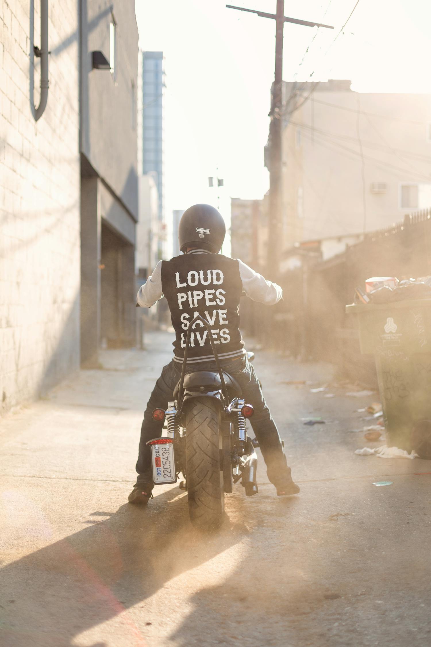 Man Wearing Black and White Jacket Riding on Motorcycke