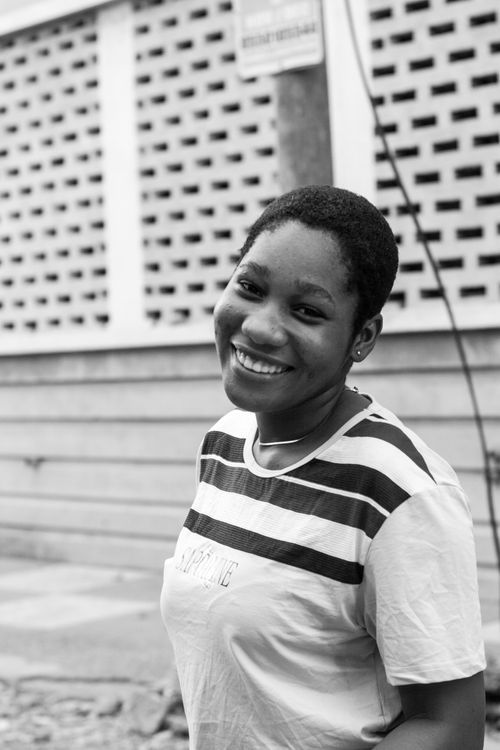 Free Monochrome image capturing the joyful expression of a smiling woman outdoors. Stock Photo