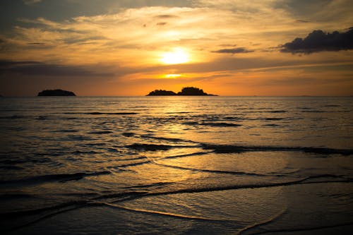Calm Ocean Water during Sunset