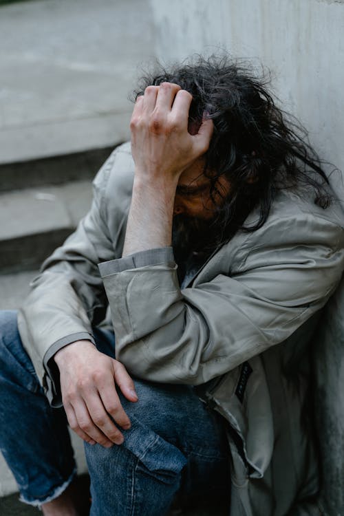 Man Resting his Head on his Hand