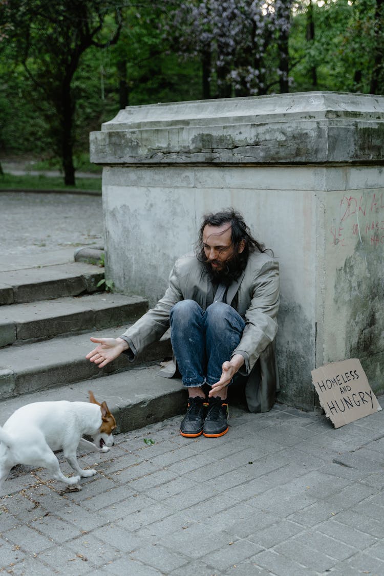 Man Sitting On The Concrete Stairs Calling The Dog 