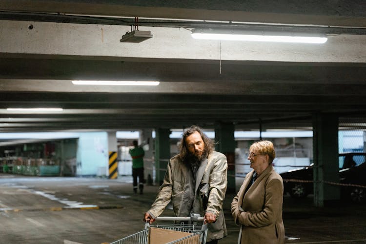 Man And Woman At A Parking Lot