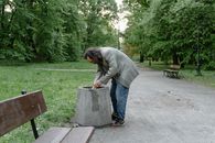 Man in Gray Coat and Denim Pants
