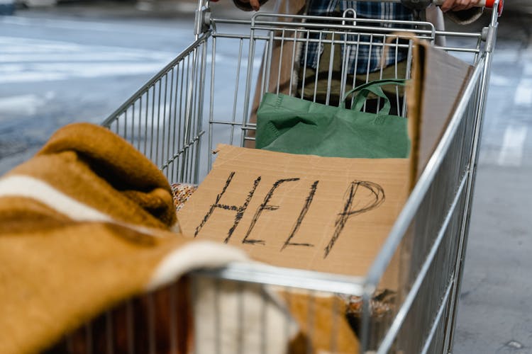 Brown Cardboard Poster On A Shopping Cart