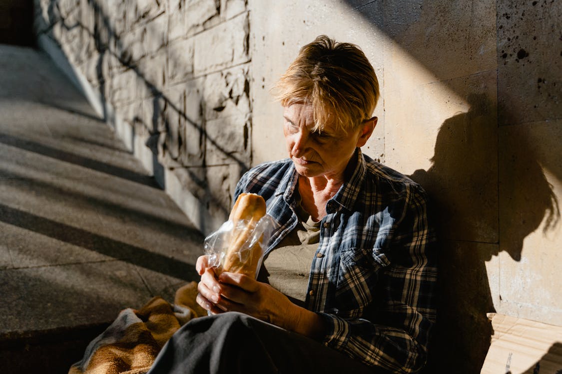 Free Woman Holding a Bread Stock Photo