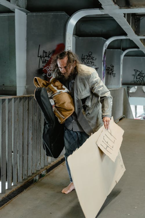 Free Homeless Man carrying his Belongings  Stock Photo
