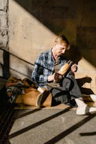 Free A Beggar with a Pack of Bread for Food Stock Photo