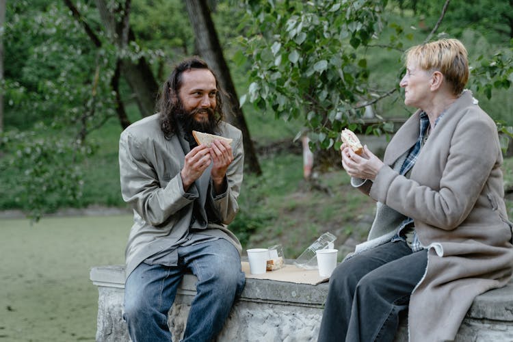 Homeless People Eating In The Park