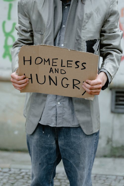 Free Homeless Man holding a Placard Stock Photo