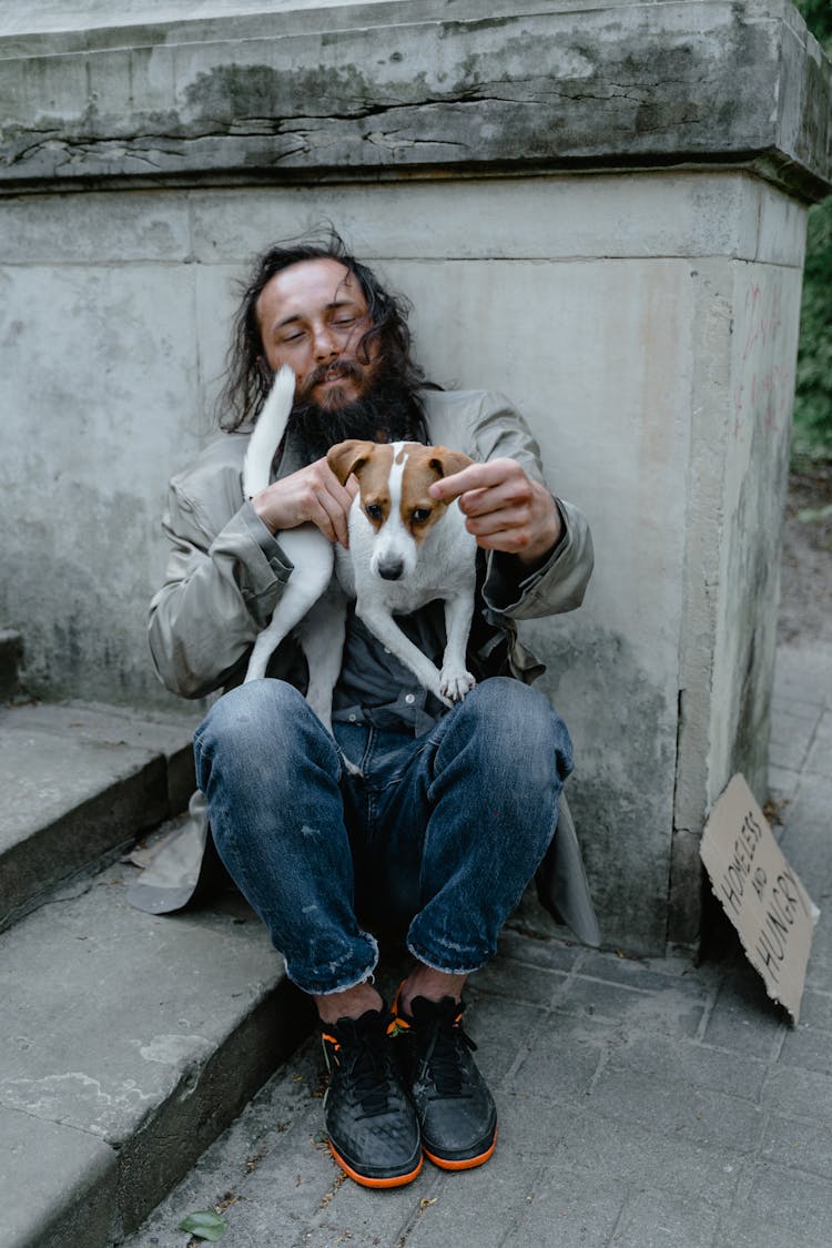 White Dog On The Man's Lap 