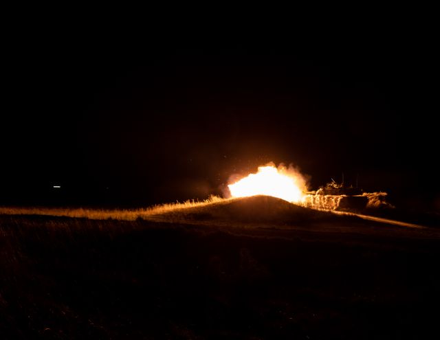 A fireball erupting against a night sky — photo by Art Guzman on Pexels