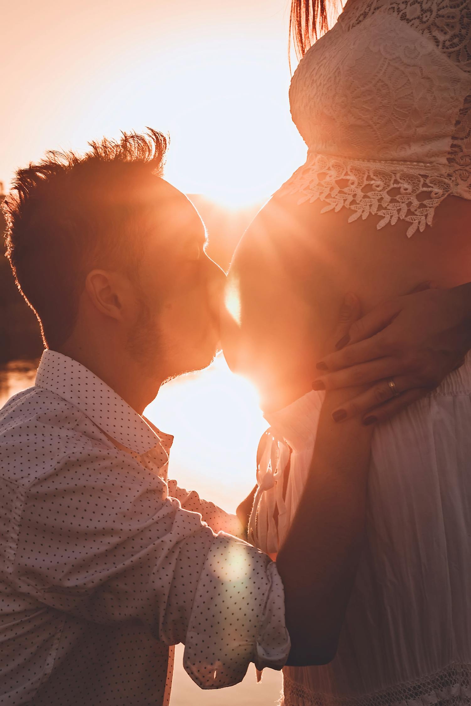 Man Kissing Woman's Belly