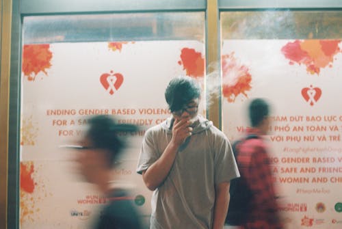 Man in Gray Shirt Smoking 