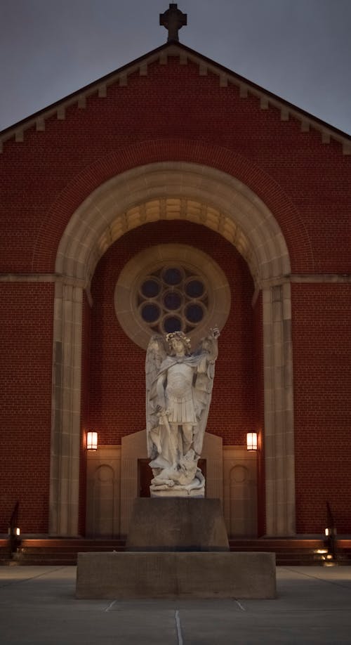 An Angel Statue in Front of a Church
