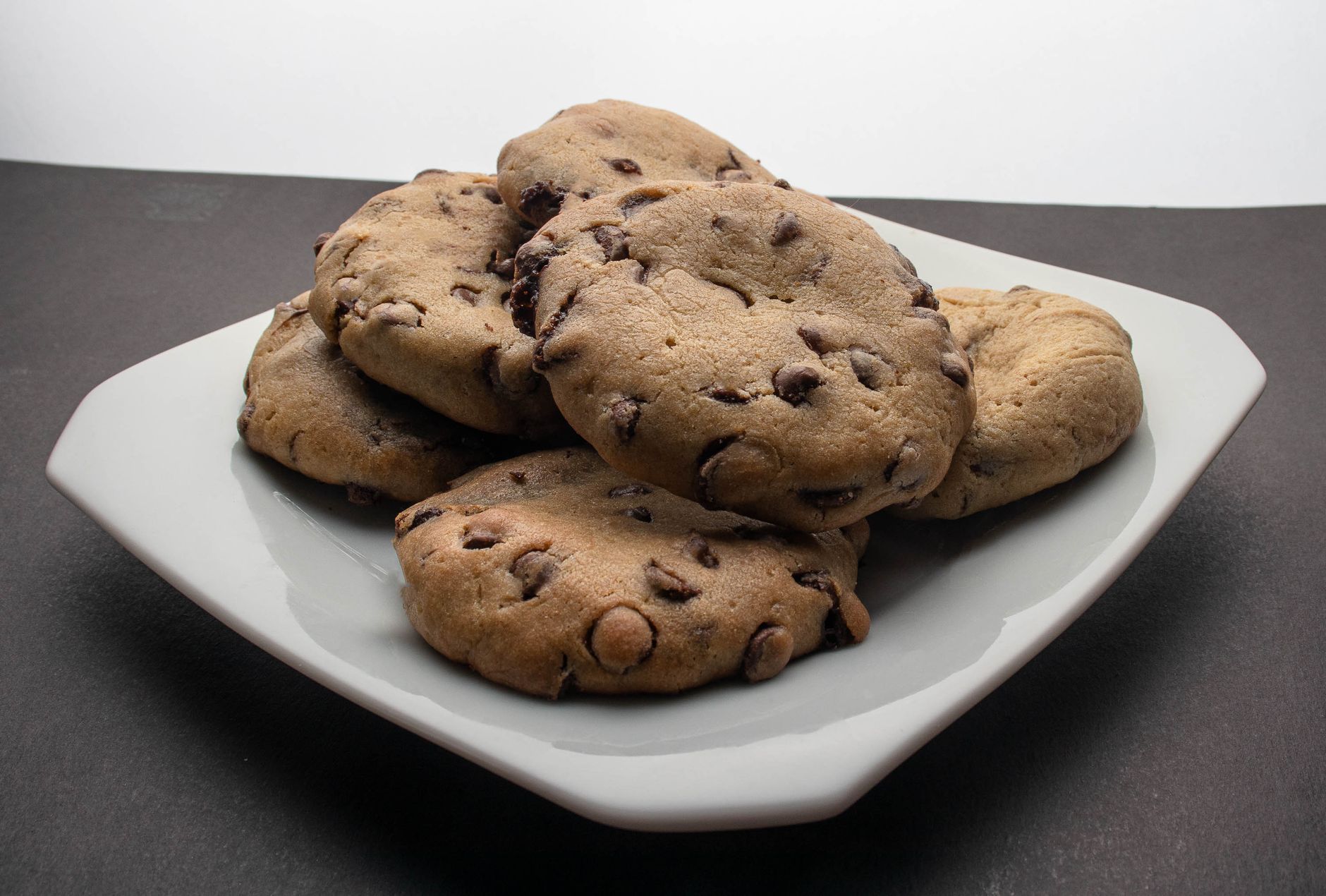 Freshly baked sugar free chocolate chip cookies cooling on a rack