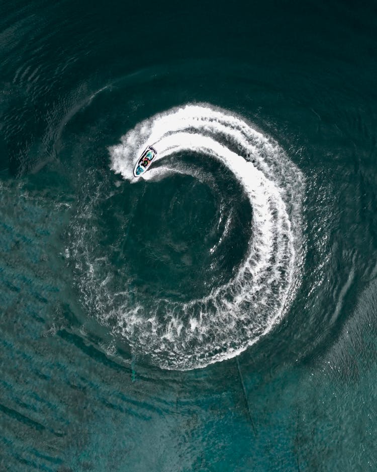 An Aerial Shot Of A Speedboat Sailing On Sea