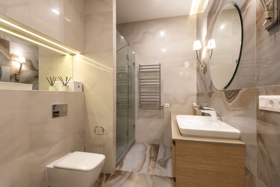 Layered LED vanity lighting design in remodeled Las Flores bathroom