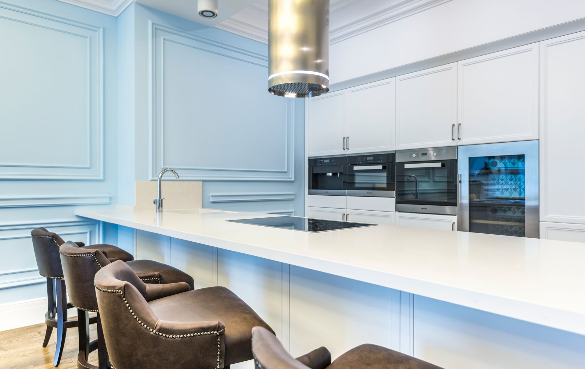 Full kitchen renovation showing cabinets, countertops, and lighting completed in Orange County