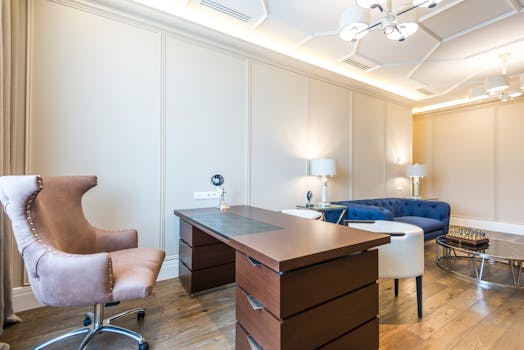 Elegant modern home office featuring luxury furniture and sophisticated design.