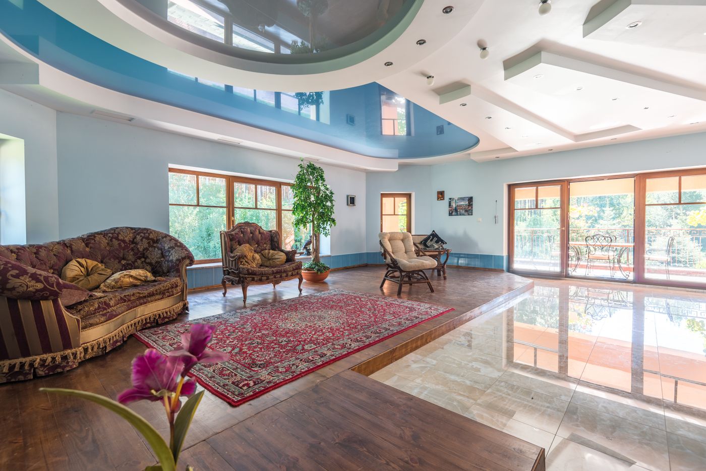 Bright living room with large windows and contemporary furnishings