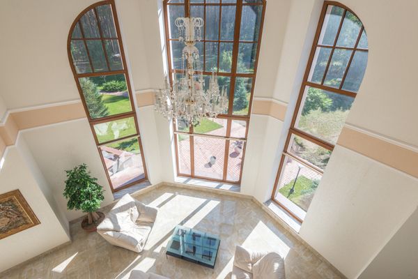 Charming stone patio with glass doors and windows in a sunny UAE villa