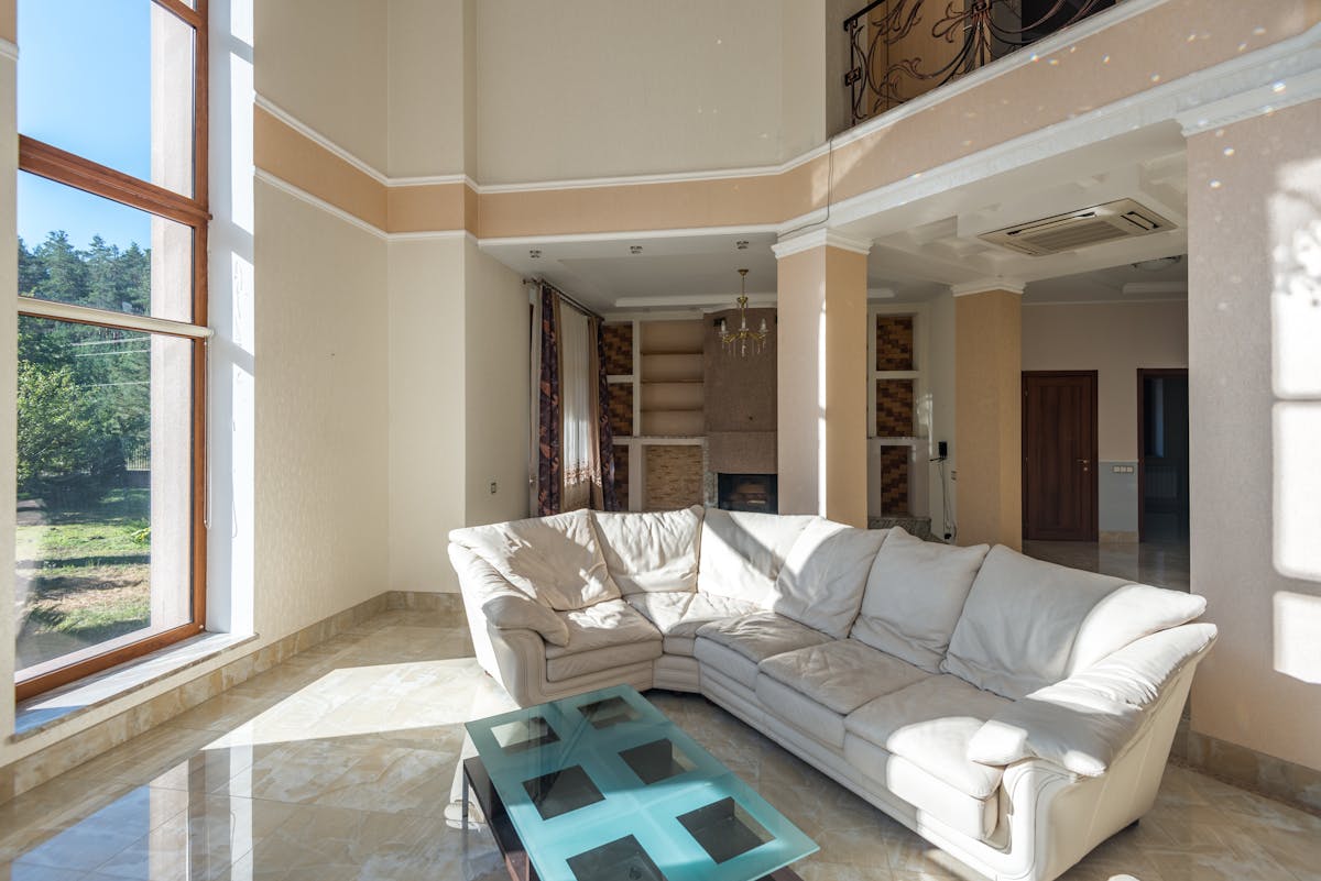 Earthy, minimalist living room with low sofa, neutral tones, and natural textures