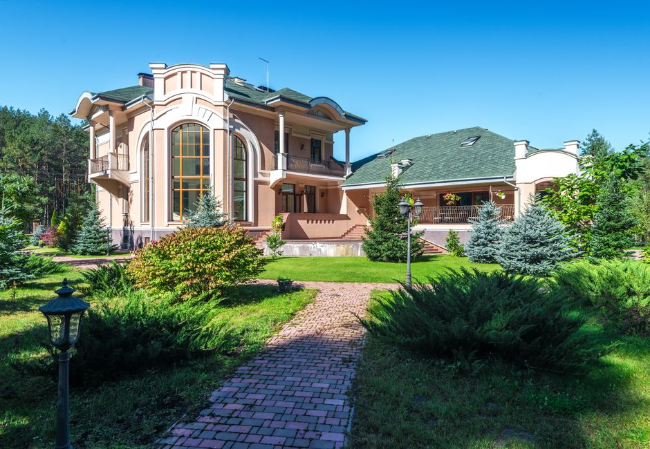 Luxury home surrounded by beautiful garden landscape