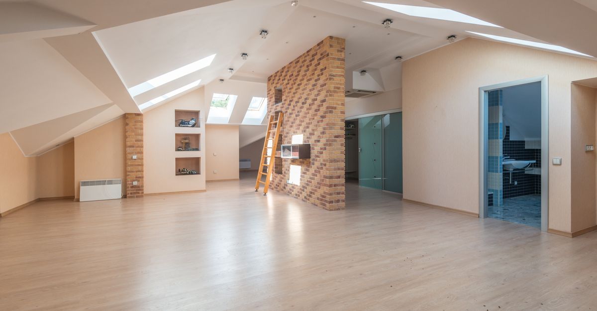 Explore this bright, spacious modern attic apartment with skylights and contemporary design.