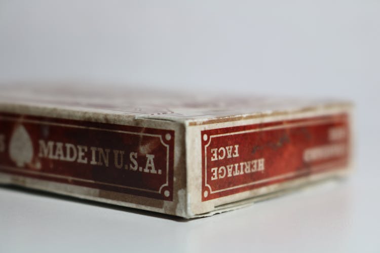 Close-Up Photography Of Dirty Playing Card Box