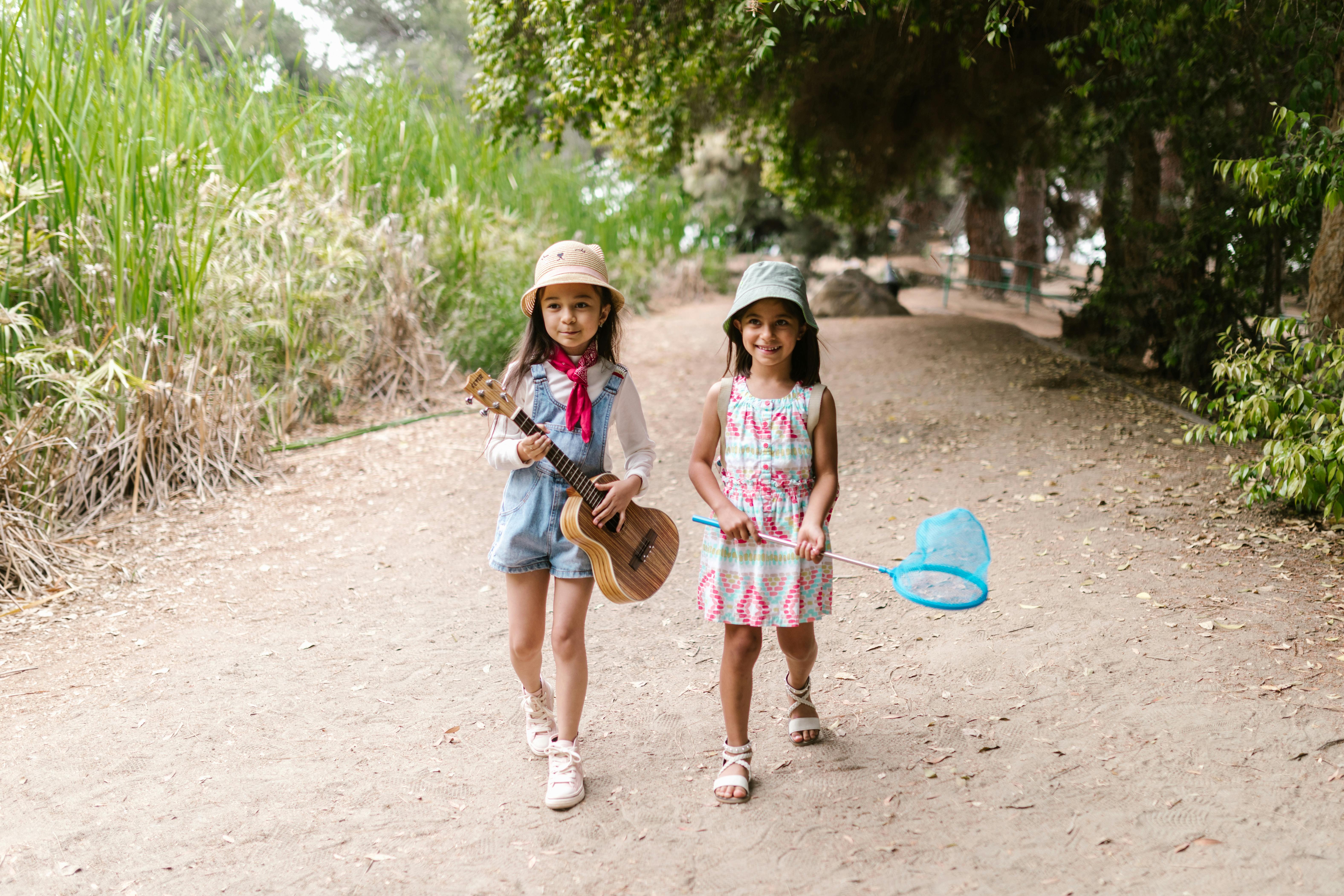 little girls in panama hats walking