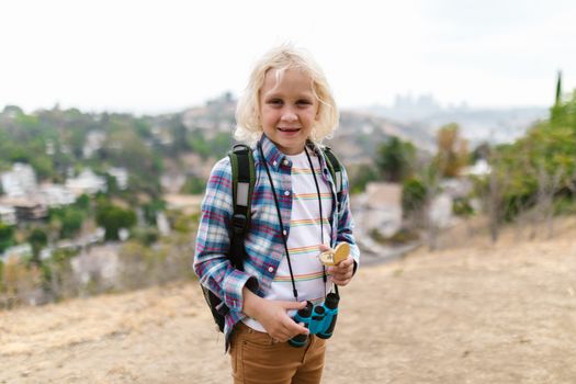 Girl in Blue and Red Plaid Dress Shirt Standing on Field