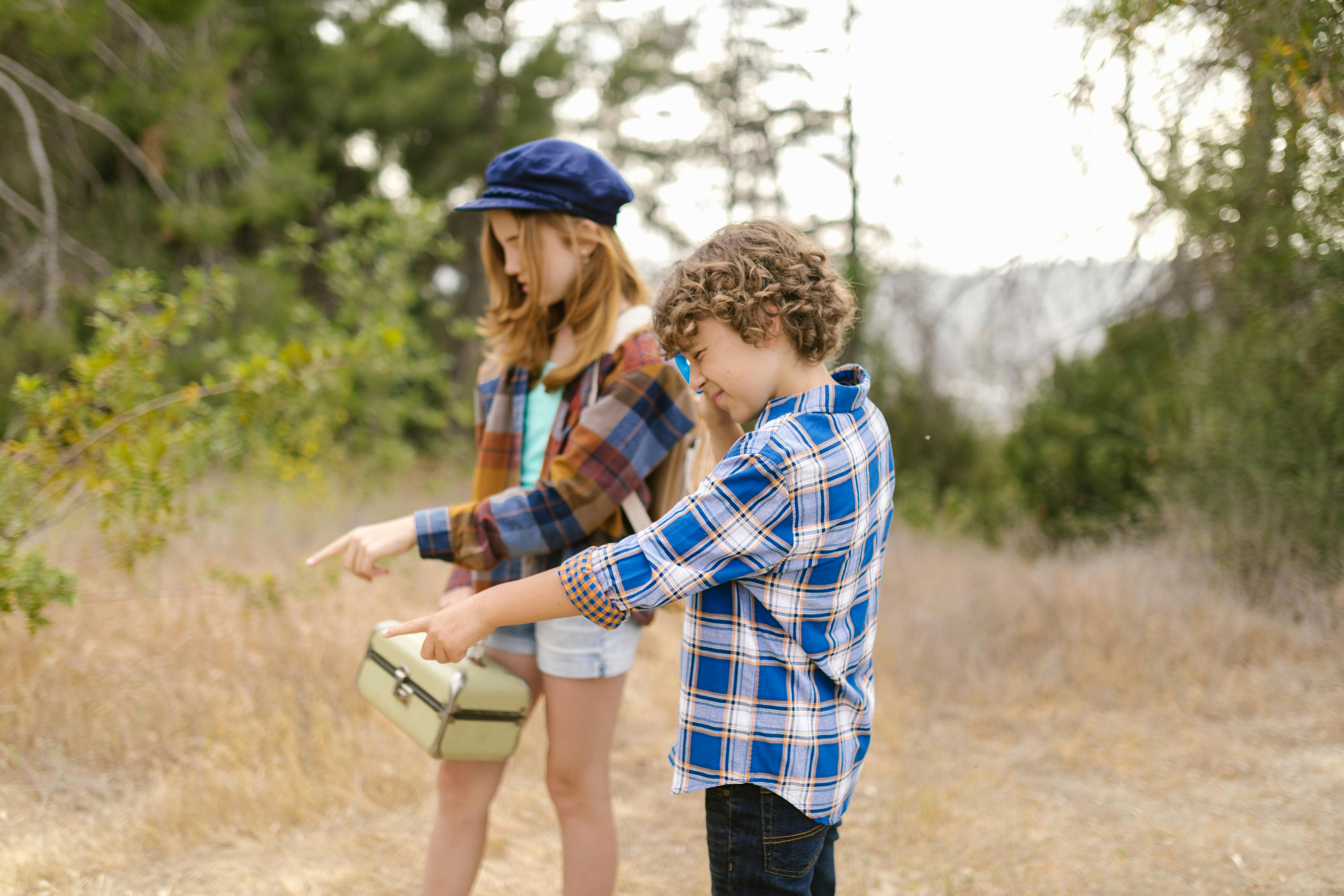 a boy and girl wearing plaid long sleeves