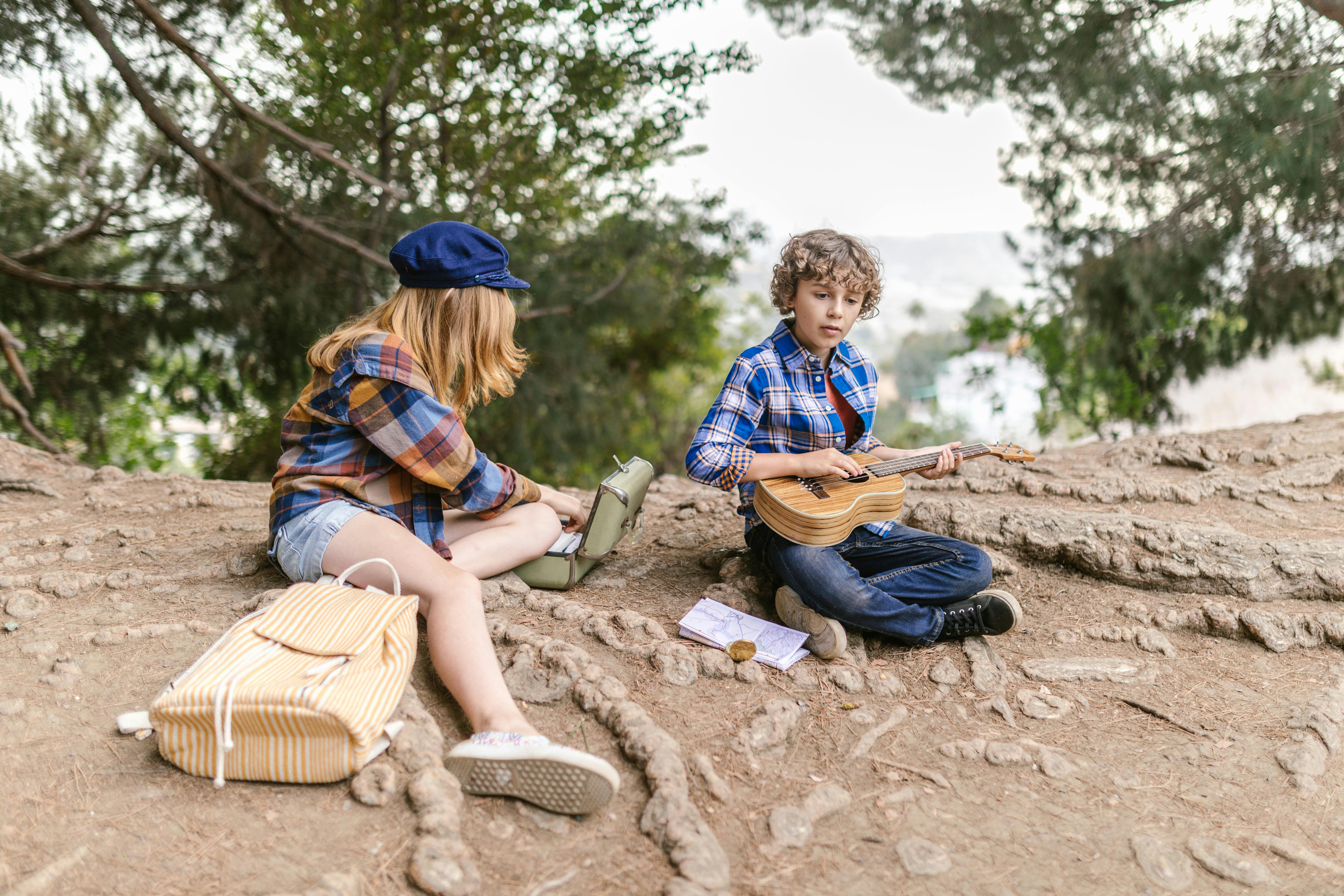 a boy and girl doing picnic together