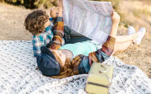 Travellers planning a route with a map