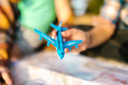 Shallow Focus Photo of a Blue Miniature Airplane