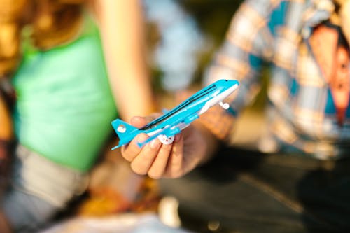 Free Close-Up Shot of a Person Holding an Airplane Toy Stock Photo