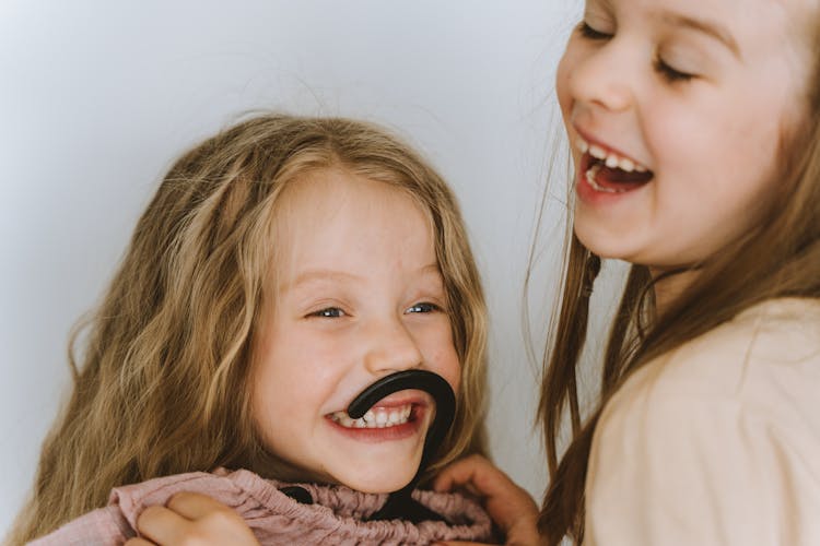 Two Girls Laughing Together 