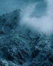 Snowy mountain slope at night