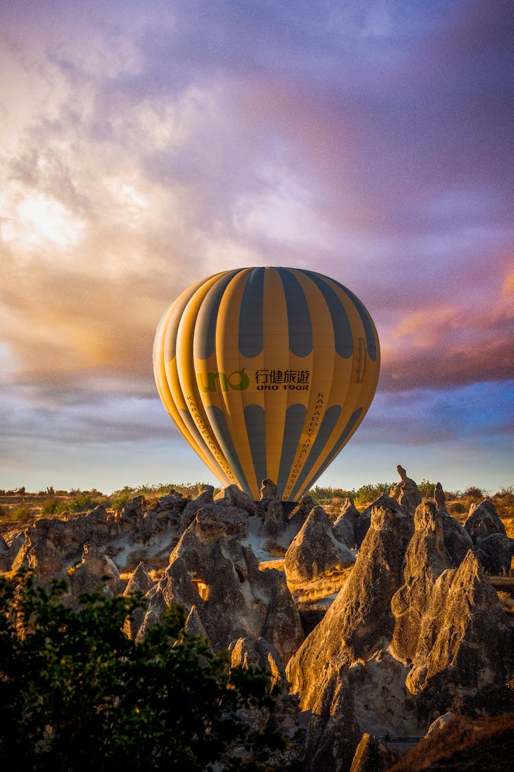 Hot Air Balloon Placed On Rocky Terrain