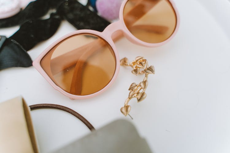 Pink Sunglasses On White Surface