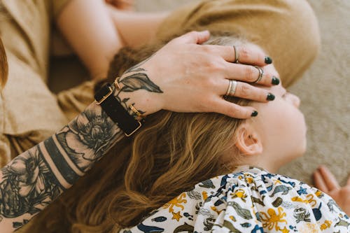 Mother Hand on Daughter Head