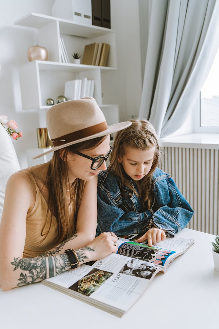 A Mother And Daughter Reading A Book