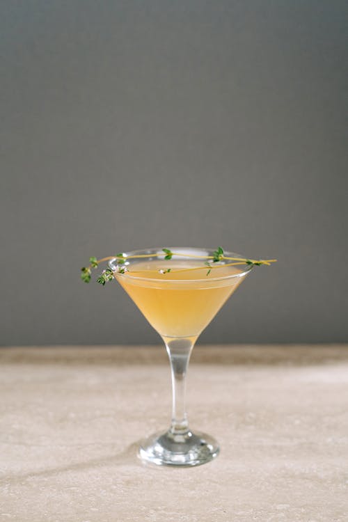 Close-Up Shot of a Cocktail Drink on Concrete Surface