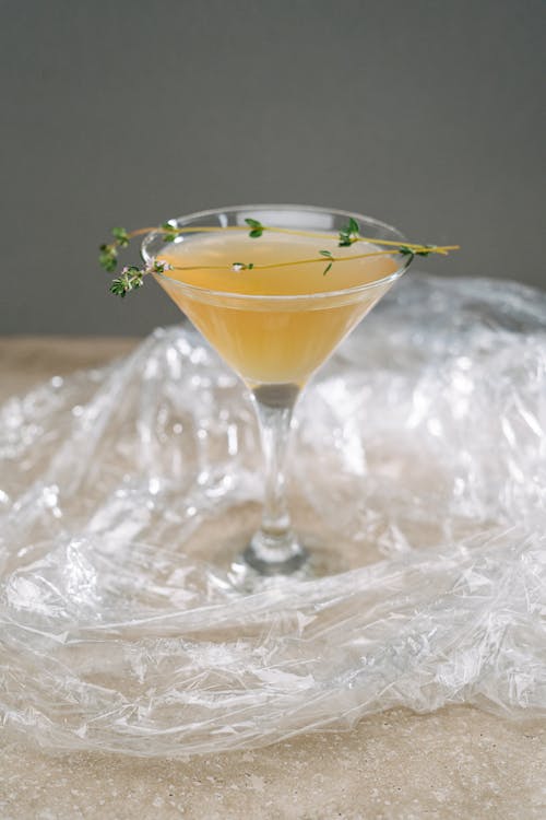 Close-Up Photo of a Cocktail Drink on Top of a Plastic