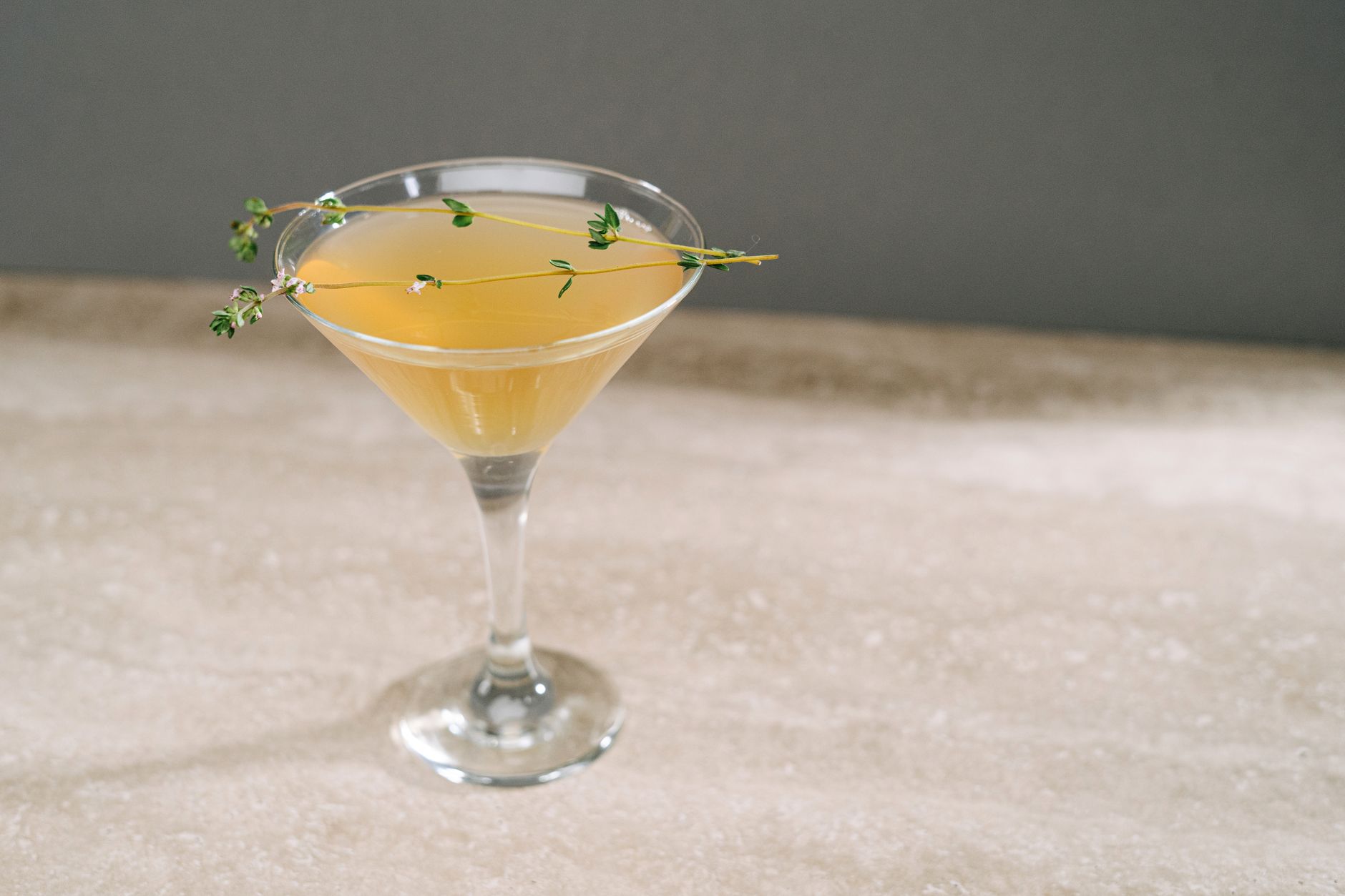 Whipped cream topping on a gingerbread martini with cookie crumbs