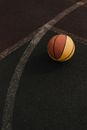 Brown Basketball on Black Textile