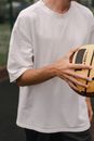 Close Up Photo of a Man Holding a Ball