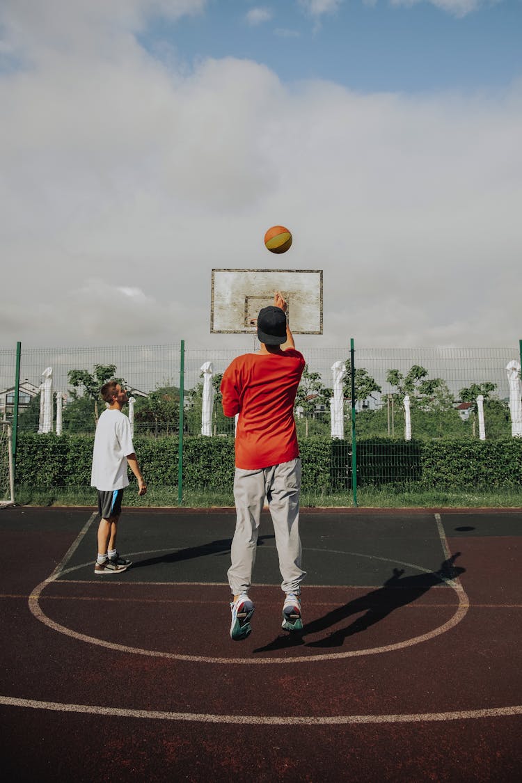 Two Boys Playing Basketball