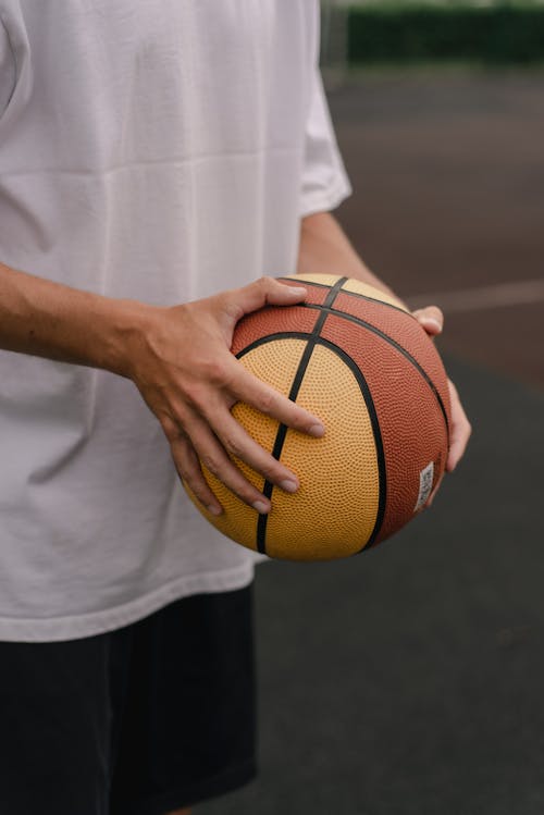Free A Person Holding a Basketball  Stock Photo