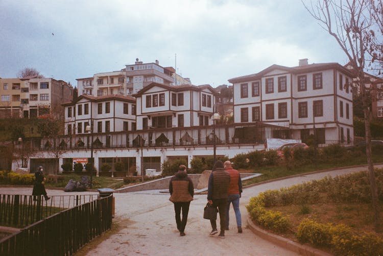 Men Walking In The Park Footpath 